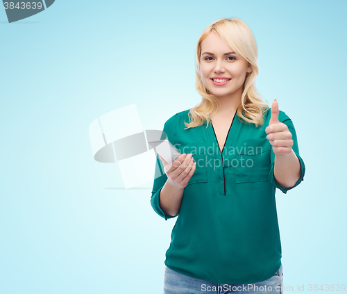 Image of happy woman with smartphone texting message
