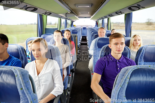 Image of group of passengers or tourists in travel bus