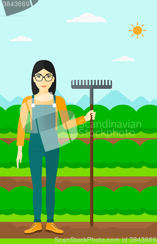 Image of Farmer with rake.