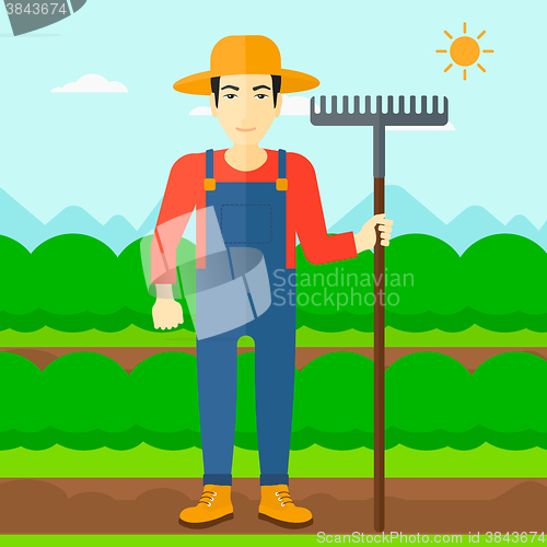 Image of Farmer with rake.