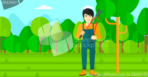 Image of Farmer with pruner in garden.