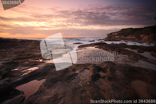 Image of Yena Bay rockshelf low tide at dawn.  