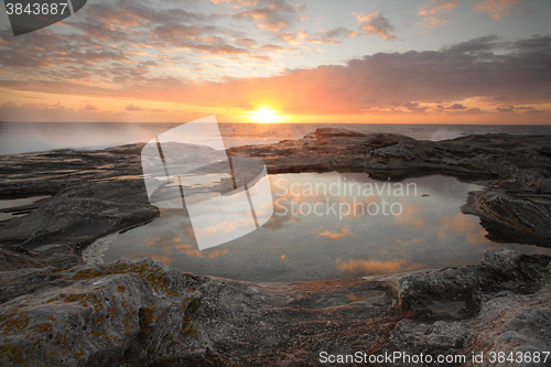 Image of Sunrise over the ocean to Yena Bay