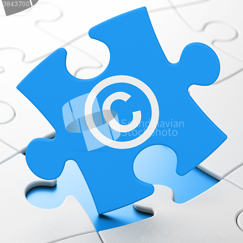 Image of Law concept: Copyright on puzzle background