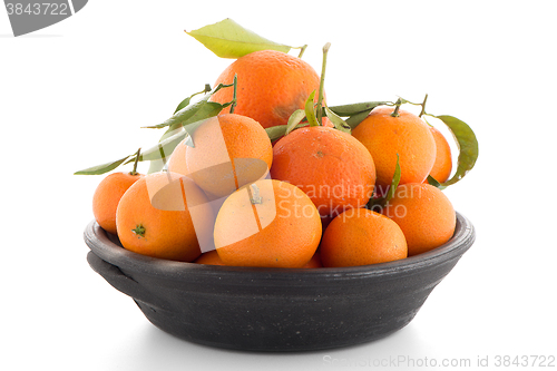 Image of Tangerines on clay bowl 