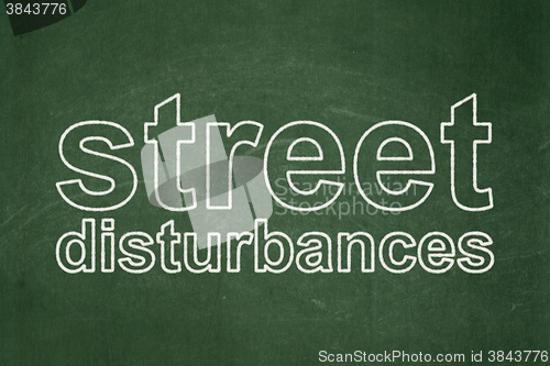 Image of Political concept: Street Disturbances on chalkboard background