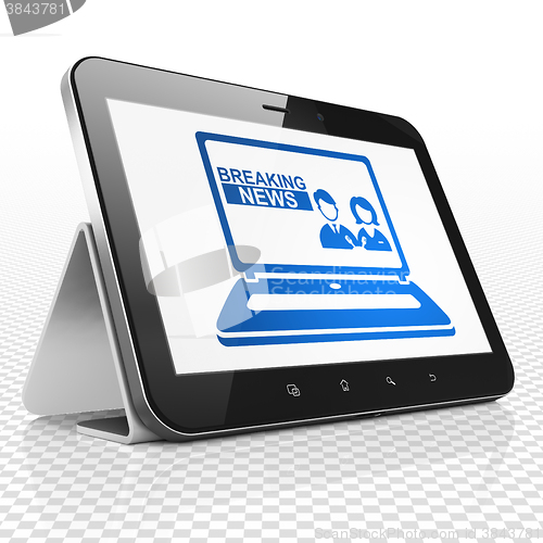 Image of News concept: Tablet Computer with Breaking News On Laptop on display
