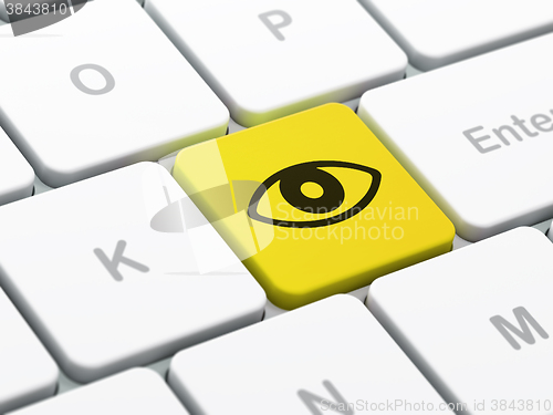 Image of Protection concept: Eye on computer keyboard background