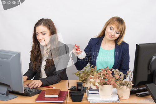 Image of Two office employee, one of which Florist amateur