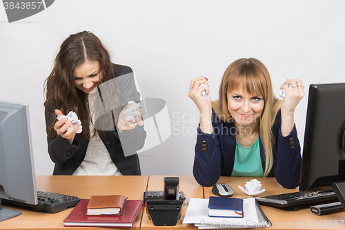 Image of Employees of the office furious crumple paper