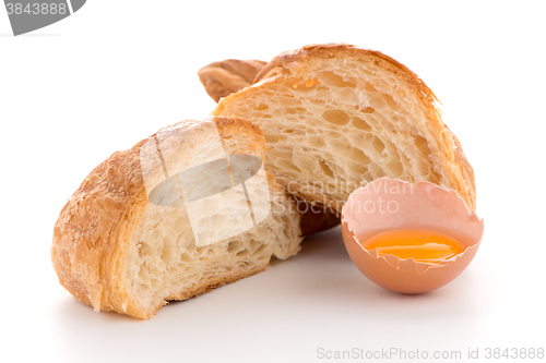 Image of Croissant and raw egg