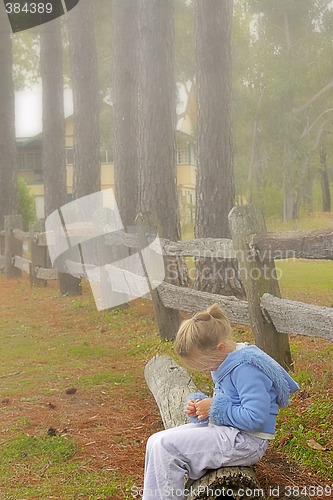 Image of girl on log