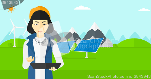 Image of Woman using tablet computer.