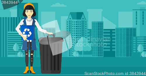 Image of Woman with recycle bins.