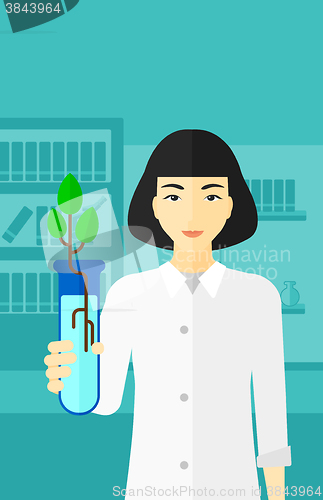 Image of Laboratory assistant with test tube.