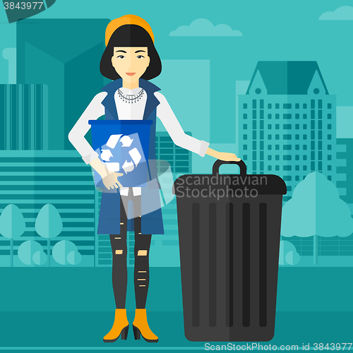 Image of Woman with recycle bins.