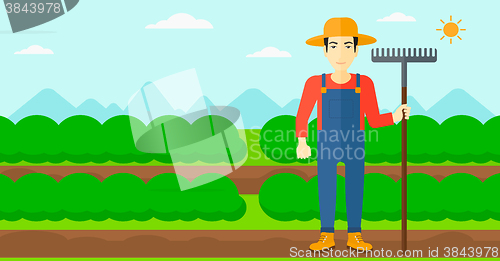 Image of Farmer with rake.