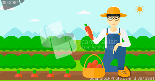 Image of Farmer collecting carrots.