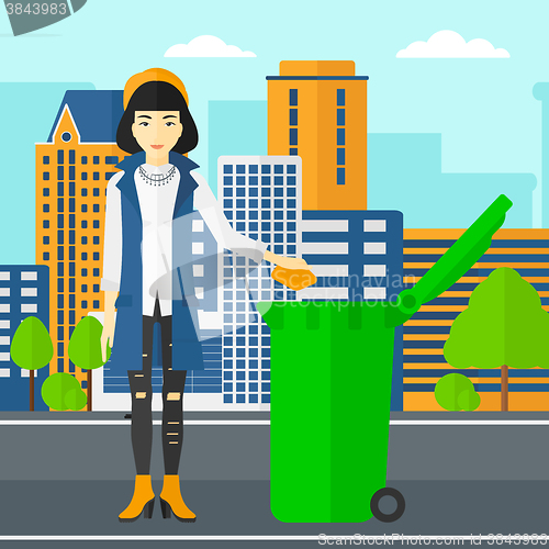 Image of Woman throwing trash.