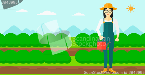 Image of Farmer with watering can.