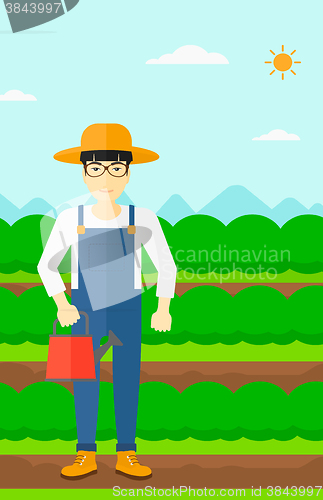 Image of Farmer with watering can.