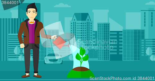 Image of Man watering tree.