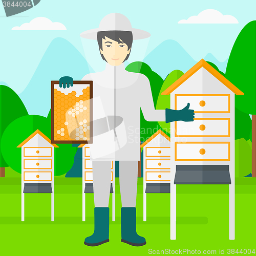 Image of Bee-keeper at apiary.