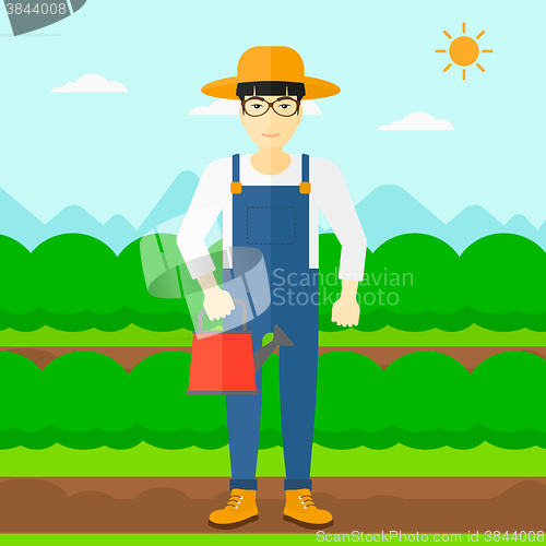 Image of Farmer with watering can.