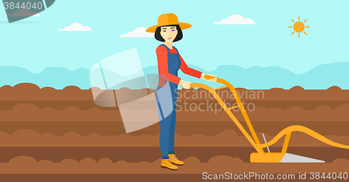 Image of Farmer on the field with plough.