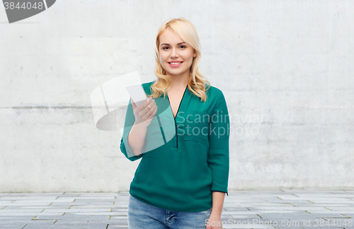Image of happy woman with smartphone