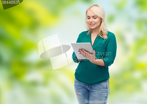 Image of smiling woman with tablet pc computer