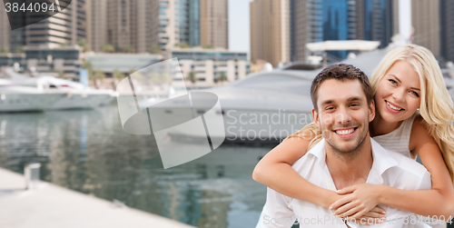 Image of happy couple having fun over dubai city harbour