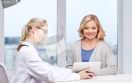 Image of doctor with tablet pc and woman at hospital