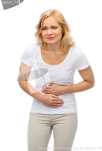 Image of unhappy woman suffering from stomach ache