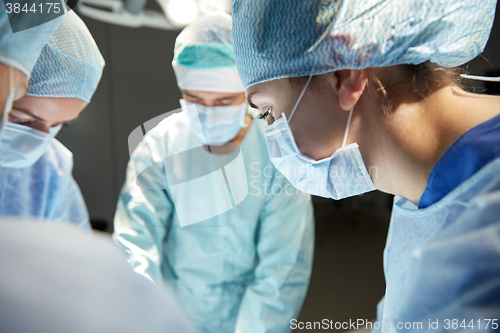 Image of group of surgeons in operating room at hospital