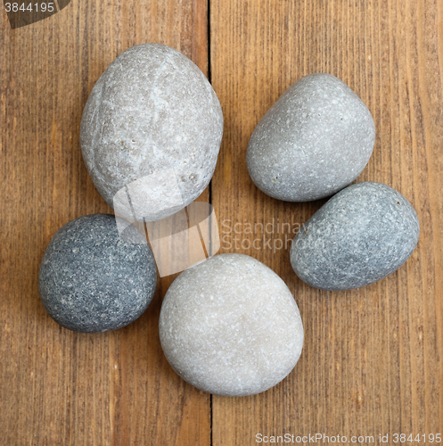Image of stones on wooden background