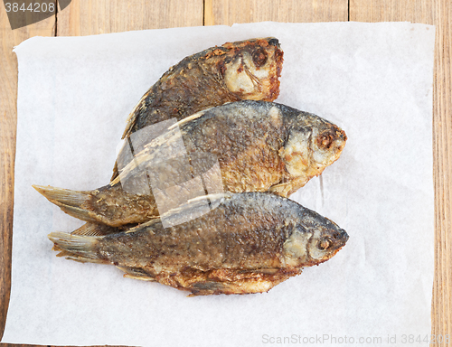 Image of fried fish on paper