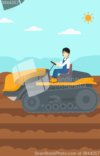 Image of Farmer driving tractor.