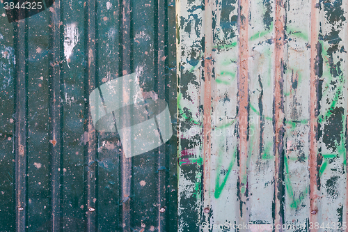 Image of Old green cracked paint on metal background