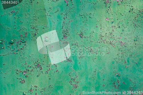 Image of Old green cracked paint on metal background