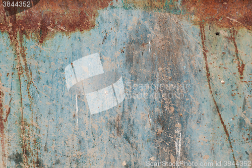 Image of Old blue cracked paint on metal background