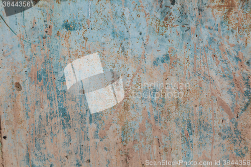 Image of Old blue cracked paint on metal background