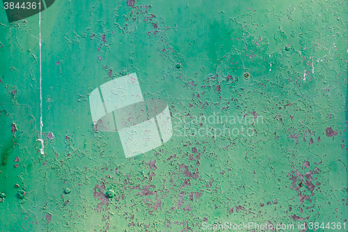 Image of Old green cracked paint on metal background