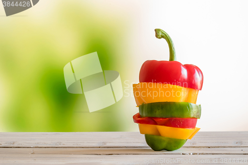 Image of Pepper stacked on a wooden table