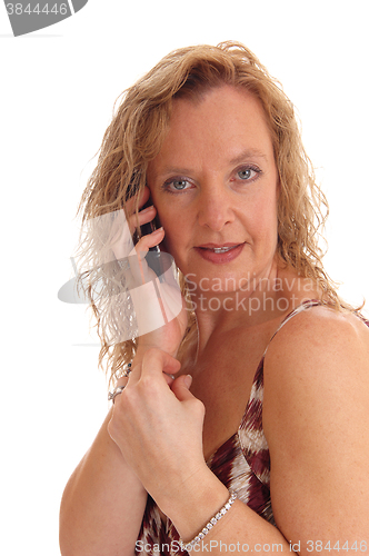 Image of Happy blond woman on cell phone.