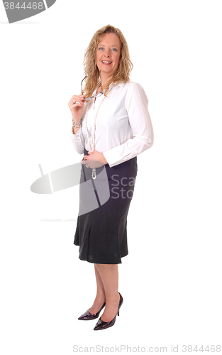 Image of Business woman standing smiling..