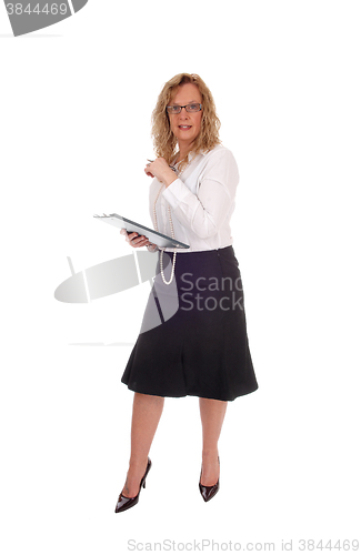Image of Business woman with clipboard. 
