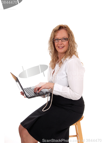 Image of Business woman working with laptop.