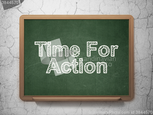 Image of Time concept: Time For Action on chalkboard background