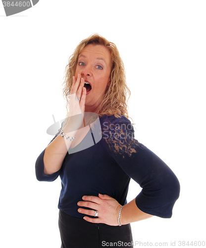 Image of Surprised blond middle age woman.